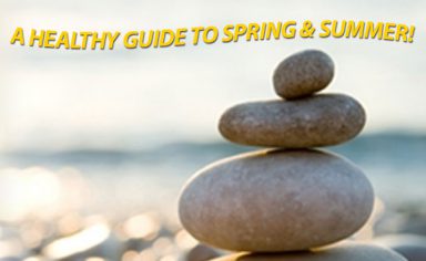 A pile of rocks on the beach with text that reads a healthy guide to spring and summer for having a healthy spring and summer